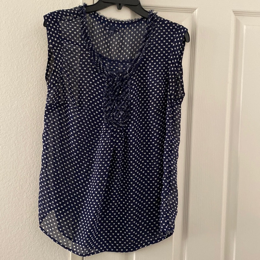 Sheer navy sleeveless blouse with white hearts pattern